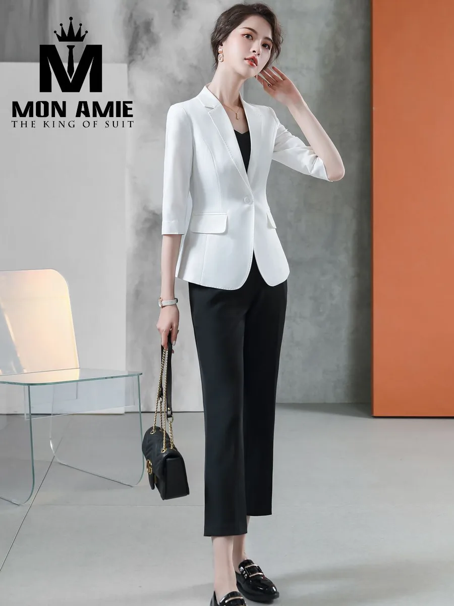 White Single-Button Blazer with Contrast Black Trousers