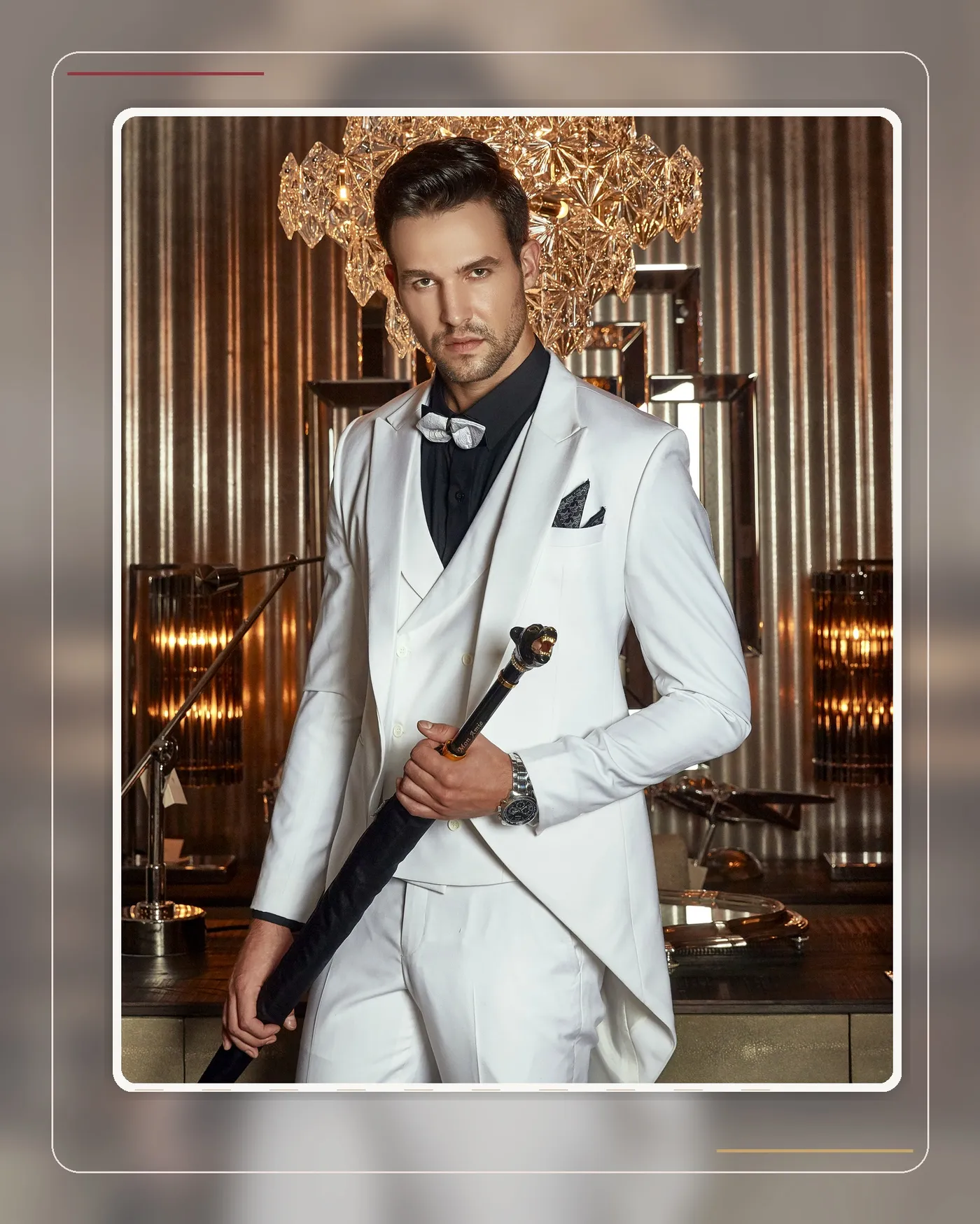 A groom in a white suit in an elegant wedding setting