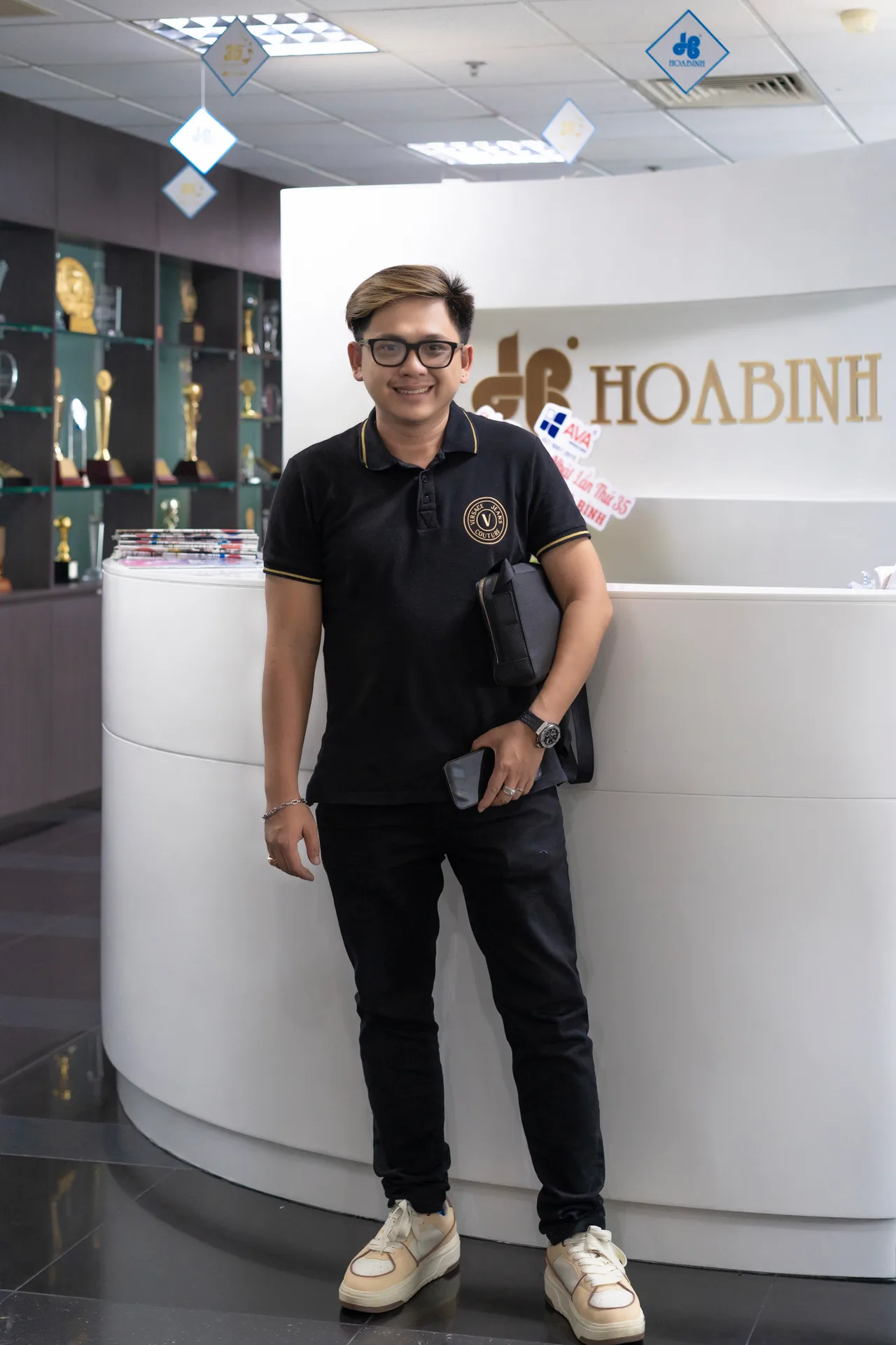 Mon Amie staff member photographed at the reception counter of a client's premises