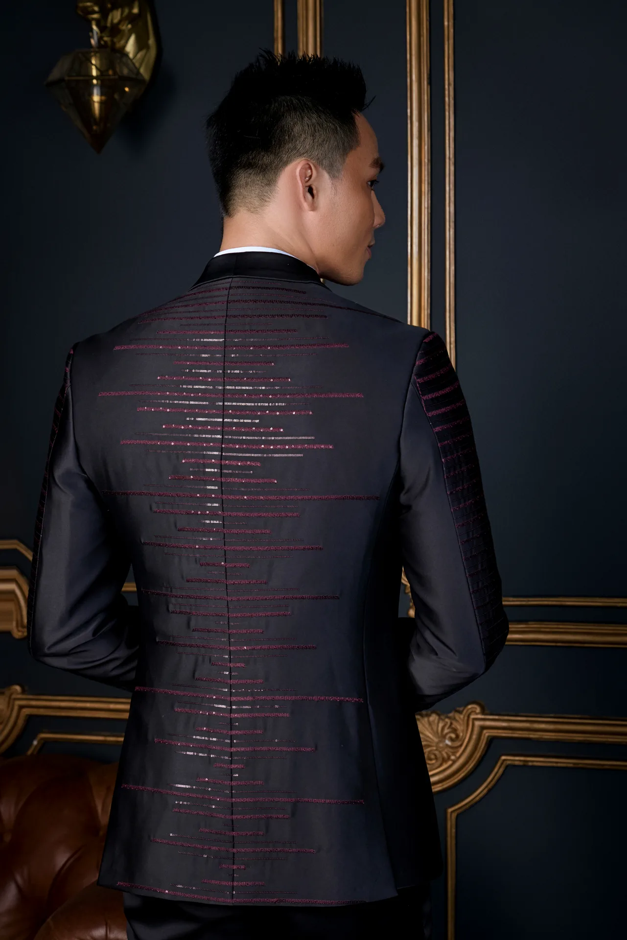 A black three-piece suit under a camel-brown overcoat, how to wear an office coat over a suit